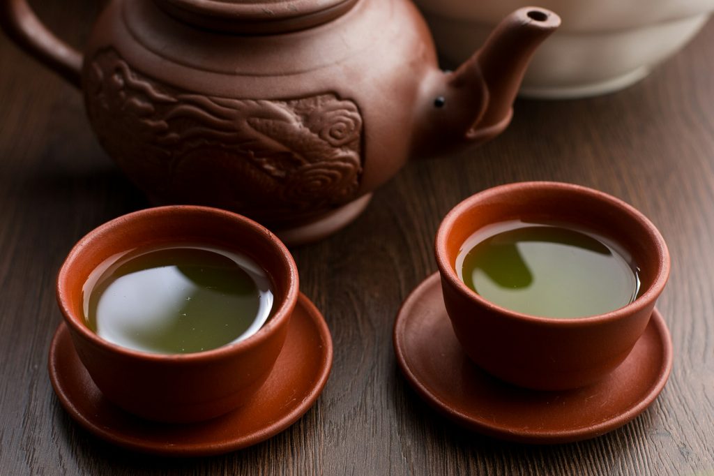 Two cups of matcha tea in a restaurant